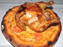 2E2675DE00000578-3306019-This_pizza_features_a_whole_roast_chicken_lay_on_top_of_what_loo-m-1_14.jpg