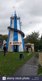 amusement-park-blue-white-helter-skelter-with-payment-on-a-rainy-day-BRTCXE.jpg
