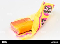 fruit-salad-sweet-retro-sweet-unwrapped-with-wrapper-closeup-R11TR9.jpg