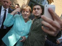 Merkel-migrant.jpg