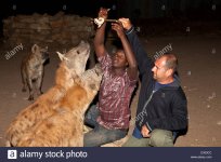 tourist-feeding-the-hyenas-harar-ethiopia-D333CC.jpeg