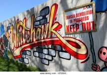 graffiti-on-boarding-at-a-building-site-in-the-whitehawk-area-of-brighton-cp22h3.jpg