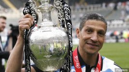 newcastle_united_manager_chris_hughton_celebrates_with_the_troph_396454.jpg