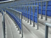 1200px-Safe_standing_area_fitted_with_rail_seats.jpg